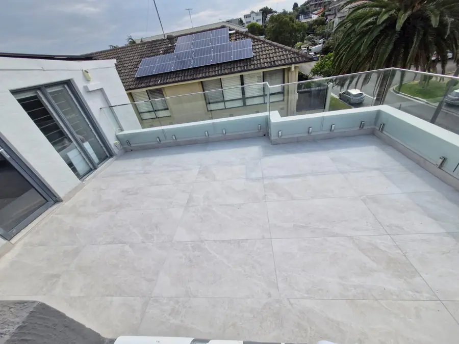 Large-format porcelain paving on a rooftop terrace