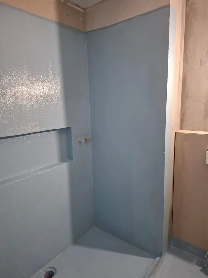 Waterproofing membrane covering the full shower recess walls and floor