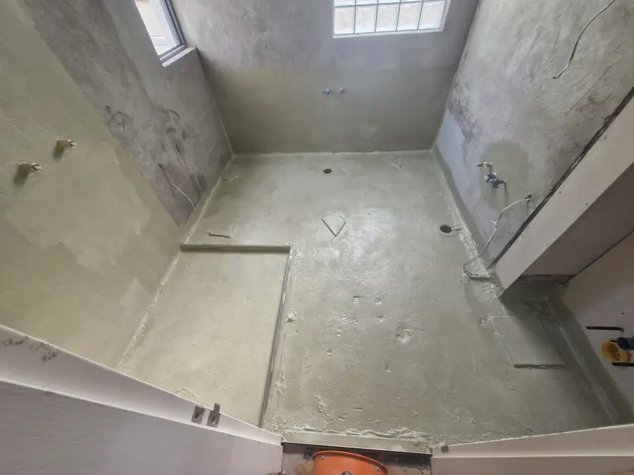 Bathroom substrate prepared and primed ahead of waterproofing